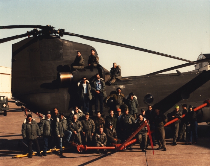 A photograph of Stan Graves and other unkown folks at an unknown location while performing Helicopter Icing Spray System (HISS) tests.