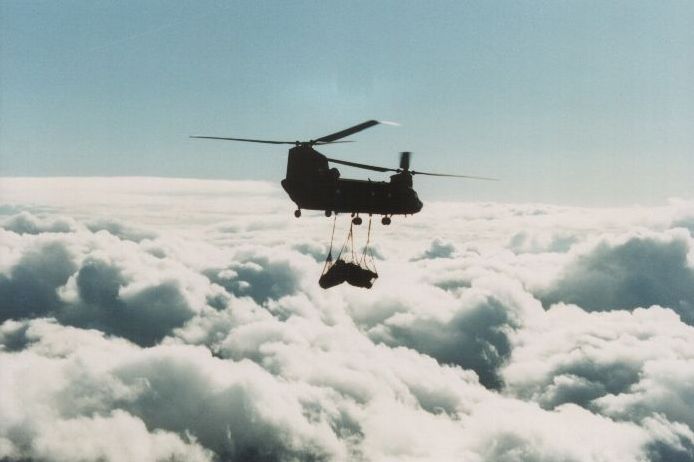 Boeing CH-47D - Transporting cargo high above the clouds.