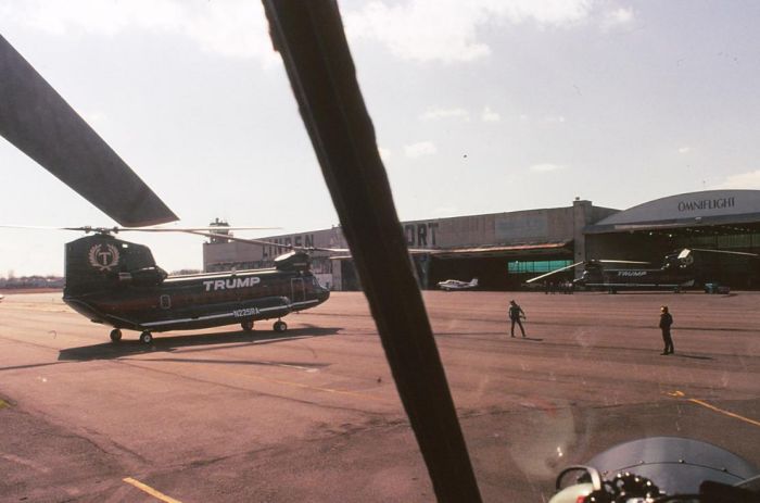 Both Trump Air Chinooks parked outside the hangar at the Linden, New Jersey airport.