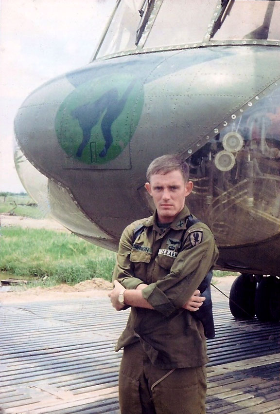 Captain Don Robinson in front of CH-47C Chinook helicopter 68-15993.