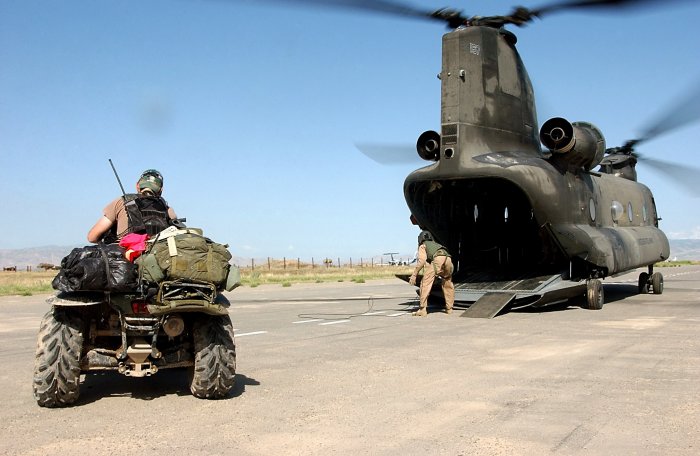 May 2002: US Army Special Forces operator prepares to drive his ATV up the ramp of CH-47D Chinook helicopter 84-24167 at Bagram Airbase, Afghanistan.