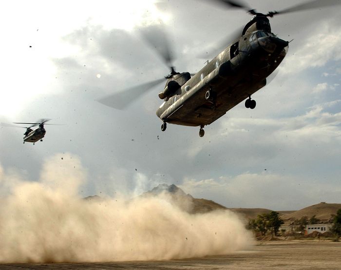 28 August 2003: A U.S. Army CH-47D Chinook helicopter, 85-24343, belonging to C Company - "Flippers", 159th Aviation Regiment, based at Fort Bragg, North Carolina, and a sister-ship carrying a delegation of U.S. Senators comes in for landing at an Afghan Army training site in Policharki, Afghanistan. The American envoys recently visited troops in Afghanistan.