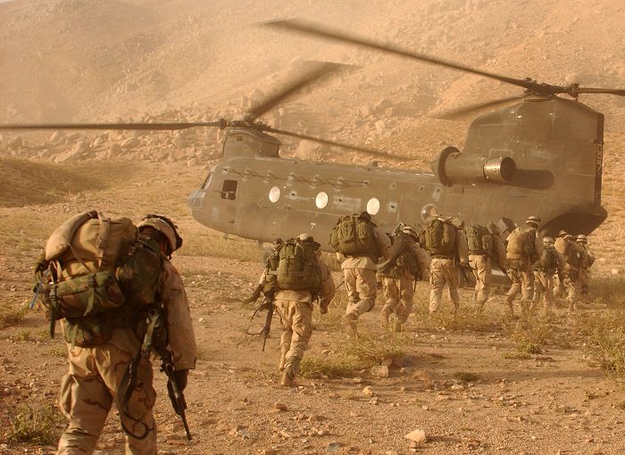 Soldiers quickly march to the ramp of 87-00097, a CH-47D Chinook helicopter belonging to the Army National Guard based in Connecticut, that will return them to Kandahar Army Air Field. The soldiers were searching for Taliban fighters and illegal weapons caches. The soldiers are assigned to Company A, 2nd Battalion, 22nd Infantry Regiment, 10th Mountain Division.