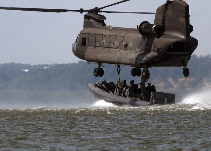 22 May 2007: Special Warfare Combatant Craft crewman (SWCC) from Special Boat Teams 12 and 20 rig their RHIB (Rigid Hull Inflatable Boat) to a US Army CH-47D Chinook helicopter in preparation for extraction.
