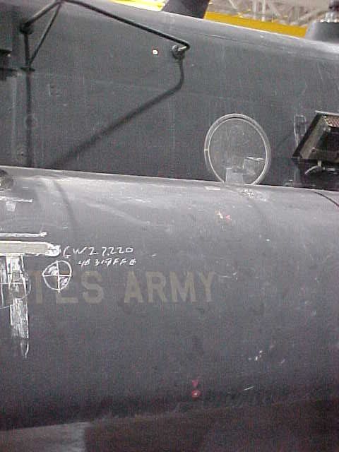 Bullet hole in fuel tank, left side.