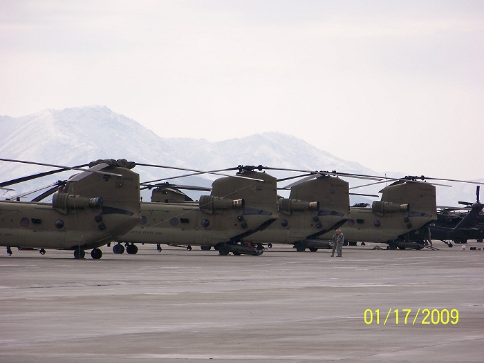 17 January 2009: CH-47F Chinook helicopter 04-08702 sitting on the ramp with it's sister ships at Bagram Air Base in Afghanistan.