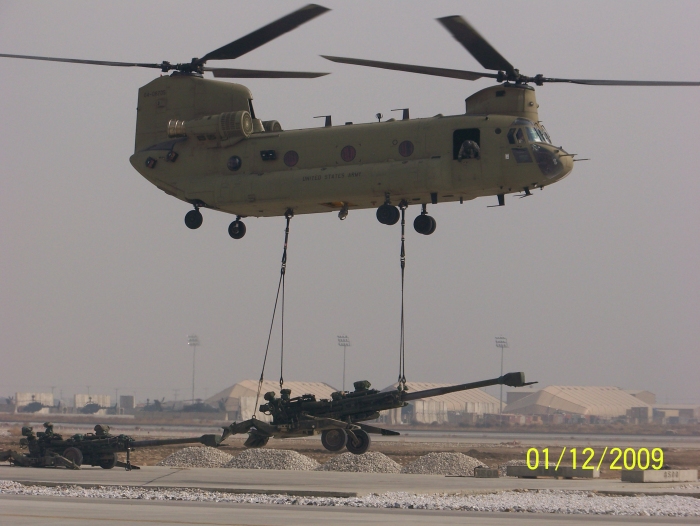 12 January 2009: CH-47F Chinook helicopter 04-08705 slinging a new M-777 Howitzer at Bagram Air Base in Afghanistan.
