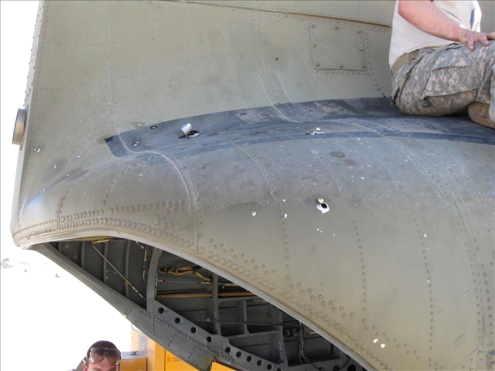 On an unknown date somewhere in Afghanistan, CH-47F Chinook helicopter 05-08015 received a hit from an RPG causing damage to the aft section of the aircraft.