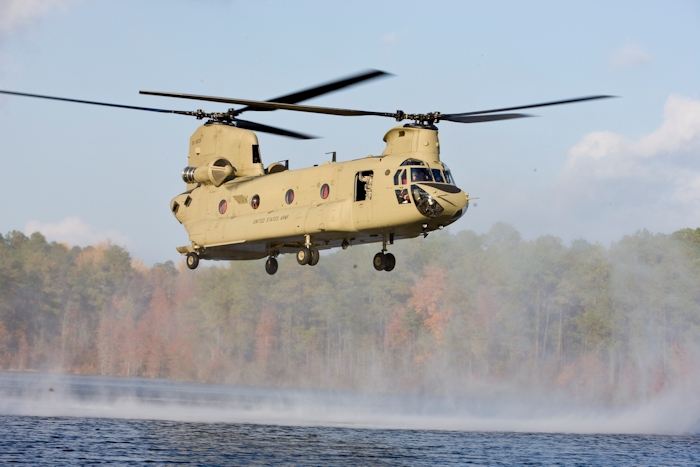 In this undated photograph taken at an unknown location, CH-47F Chinook helicopter 06-08028 hovers over a lake.