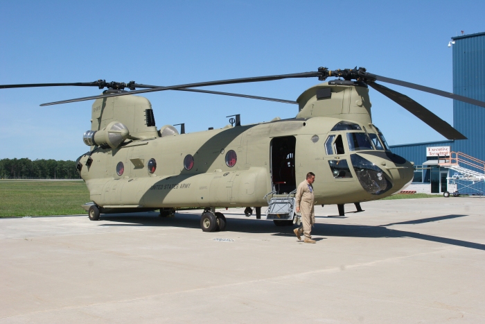 26 June 2010: CH-47F Chinook helicopter 07-08735 is prepped for preflight by Bruce "Blackwater" Cain at Millville Airport (KMIV), New Jersey.