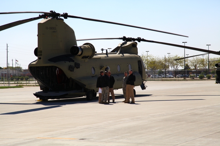11 April 2012: Sortie 1 pilots discuss the situation next to CH-47F Chinook helicopter 10-08083 on the ramp at Sioux City Airport.