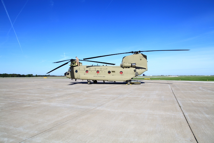 20 September 2012: CH-47F Chinook helicopter 10-08806 receives a post-flight inspection from NET Team Flight Engineer Robert Muller during a fuel stop at Quincy Regional Airport (KUIN), Illinois.