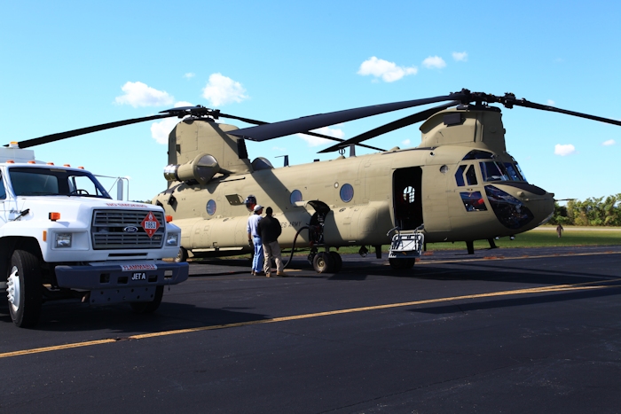 19 September 2012: CH-47F Chinook helicopter 10-08807 receives fuel at Wheeling, West Virginia (KHLG), supervised by Flight Engineer Bruce Cain.