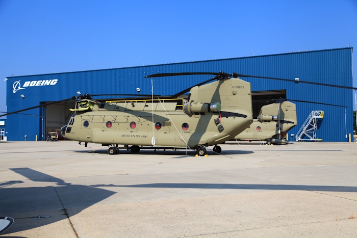 11 September 2013: CH-47F Chinook helicopter 11-08839 rests on the ramp at the Boeing Millville facility, Millville Municipal Airport (KMIV), New Jersey, awaiting movement to the Port of Baltimore for ship transport to the Republic of Korea. Behind it sits 11-08837, also on its way to Korea.