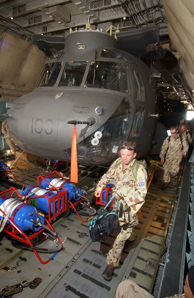 Australian CH-47D Chinook, tail number A15-103, inside a U.S. Air Force Reserve C-5 Galaxy transport aircraft.
