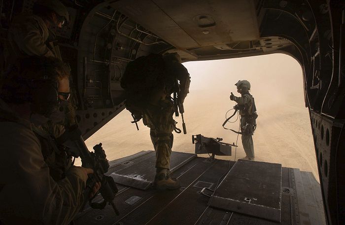 As the Flight Engineer gives the thumps up, members of the Australian Special Forces Task Group (SFTG) prepare to conduct operations in the Middle Eastern Theater.