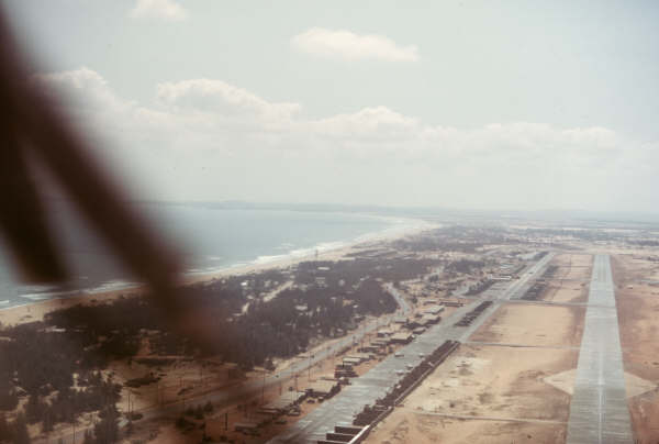 On final approach to East runway at Chu Lai, landing to the south. (Chu Lai, RVN, undated)