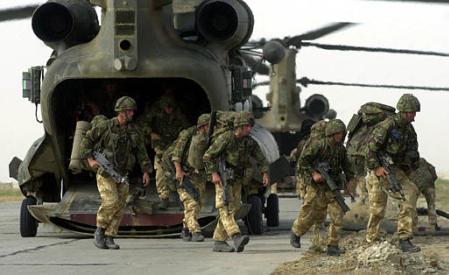 British Royal Marines of 45 Commando disembark from Chinook helicopters.