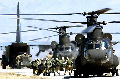 This photo, dated 12 March 2002, shows US soldiers disembarking from a CH-47D Chinook helicopter at Bagram Air Base, after returning from the Arma mountain region near Gardez in Afghanistan.