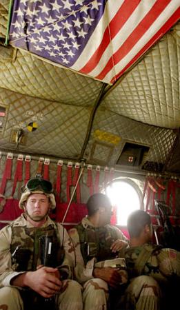 82nd Airborne Division soldiers deploy aboard a CH-47D Chinook helicopter.