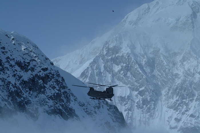 Alaska, 7 July 2010: A CH-47 Chinook helicopter from Fort Wainwright's B Company, 1st Battalion, 52nd Aviation Regiment, flies along Mount McKinley on a mission. The unit recently transported a climber from the base camp at 14,000 feet when he began acting in a strange manner.