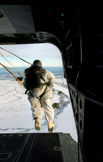 Command Sergeant Major (CSM) Carlos Pagan jumps from a CH-47D Chinook helicopter for an air assault on the fictional town of Simpsonville in the Yukon Training Area west of Fort Greely, Alaska, during Exercise Northern Edge 98, on 20 February 1998. More than 90,000 Soldiers, Sailors, Marines, Airmen, Coast Guardsmen and National Guardsmen are participating the exercise. Northern Edge 98 is designed to practice joint operational techniques and procedures, increasing interoperability between the services. Pagan is the Command Sergeant Major for the 1st Battalion, 6th Infantry Division (L), Fort Greely, Alaska.