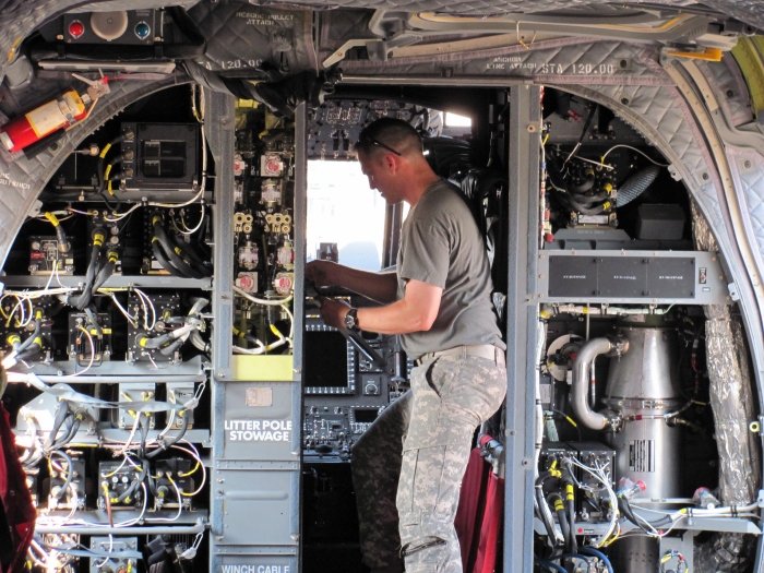 Army Chief Warrant Officer 3 Jason Franzen, CH-47F Acceptance Test Pilot, performs a preflight inspection on an Army CH-47F Chinook helicopter at Boeing's Ridley Park, Pennsylvania, facility.