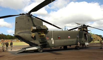 Members of the Army National Guard conduct maintenance on a CH-47D Chinook helicopter [tail number unknown] on Tuesday, 6 January 2004. Stationed at Wheeler Army Air Field, Hawaii, the soldiers are preparing for an expected 18 months of active duty, including deployment to Iraq.