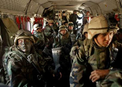 15th MEU soldiers in the cargo section of a Chinook.