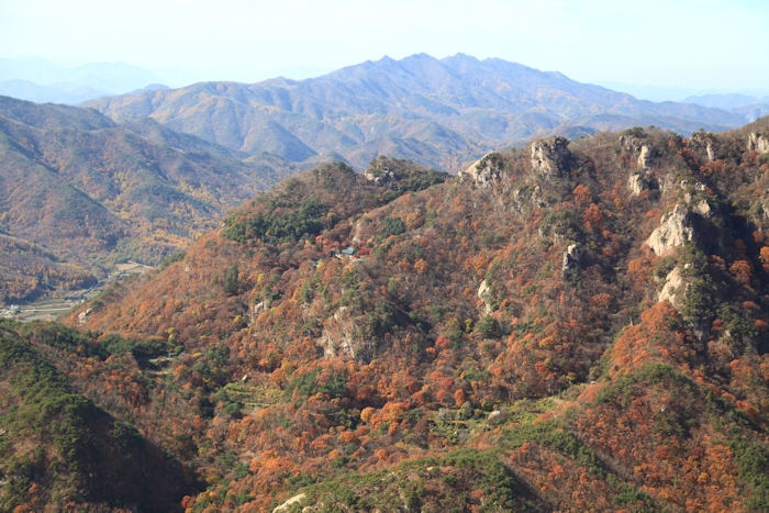 8 November 2013: Nestled in the mountains a Buddhist Temple was spotted along the way.