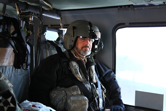 3 November 2013: CH-47F Chinook helicopter Standardization Instructor Tim Coffman rides in the back of a UH-60 "Blackhawk" to the Port of Busan (Pier 8) from Camp Humphreys in the early morning hours.