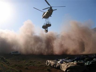 16 November 2005: A British Royal Air Force Chinook helicopter lifts aid supplies for earthquake victims at an air strip near Muzaffarabad.