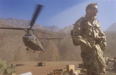 15 November 2005: In this handout photo provided by the Australian Department of Defense, an Australian soldier turns away as an American Chinook helicopter, which delivered his team and Australian humanitarian assistance supplies, takes off in Dahanni, Pakistan, on Tuesday. An Australian Defense Force medical team began to deploy into Pakistan mid-November 2005 to provide vital health care assistance as part of the Australian Government's relief assistance to Pakistan following the earthquakes on 8 October 2005.