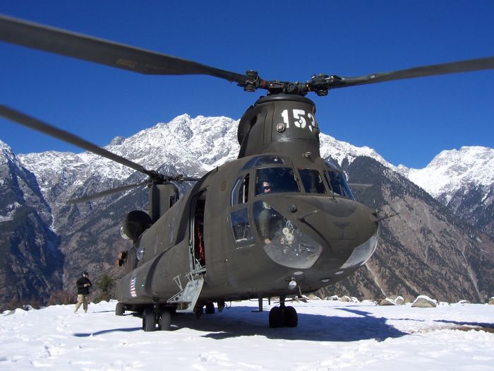 A CH-47D belonging to the United States of America lands at high elevation in the mountains of Pakistan, providing much needed disaster relief supplies.