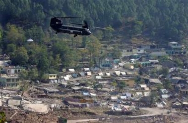 2 November 2005: A U.S. Chinook helicopter leaves Balakot, Pakistan-administered Kashmir, about 180 km (112 miles) north of Islamabad, after unloading relief supplies. The U.S. military said it planned to resume helicopter relief flights in Pakistan's earthquake zone on Wednesday, even though it believes one was fired on by a rocket propelled grenade the previous day. The Pakistani Army called Tuesday's incident close to Chakothi, a town near the border with Indian Kashmir, misunderstanding caused by the U.S. helicopter crew mistaking engineers blasting a damaged road for attackers.