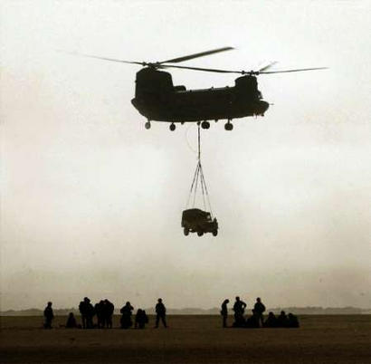 A British Chinook helicopter transports a vehicle somewhere in the Gulf.
